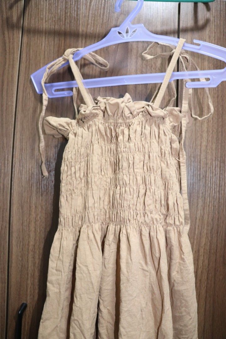 Smocked Dress with Hat (Category: Dresses) located in Cavite. Submitted by trishadvb (Listing ID 1362231164, Image 1). Description: Maxi smocked dress with hat Like new Color: Brown Fits XS-Medium Self-tie straps, can be worn as tube dress Free SF if will get another item from my listings 🤗.