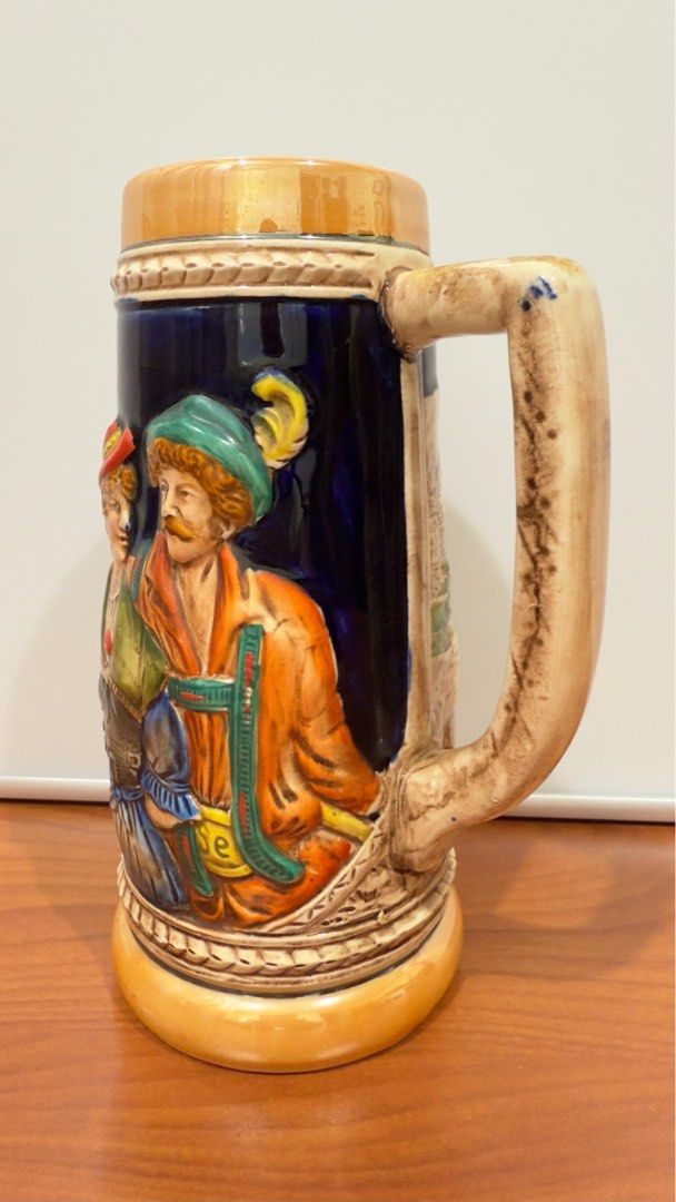 Vintage KW German Ceramic Stein Mug (Category: Other Kitchenware & Tableware) located in Binangonan. Submitted by c_r_i_s (Listing ID 1362160240, Image 2). Description: Vintage KW German Ceramic Stein Mug 8 1/4 inches tall. 5 inches wide with handle. Two and seven eights inch top diameter. Hand painted. Raised man, lady, and countryside on sides No chips and cracks. Very beautifully crafted! In excellent condition!.