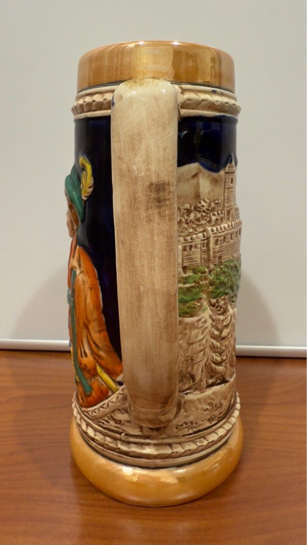 Vintage KW German Ceramic Stein Mug (Category: Other Kitchenware & Tableware) located in Binangonan. Submitted by c_r_i_s (Listing ID 1362160240, Image 3). Description: Vintage KW German Ceramic Stein Mug 8 1/4 inches tall. 5 inches wide with handle. Two and seven eights inch top diameter. Hand painted. Raised man, lady, and countryside on sides No chips and cracks. Very beautifully crafted! In excellent condition!.