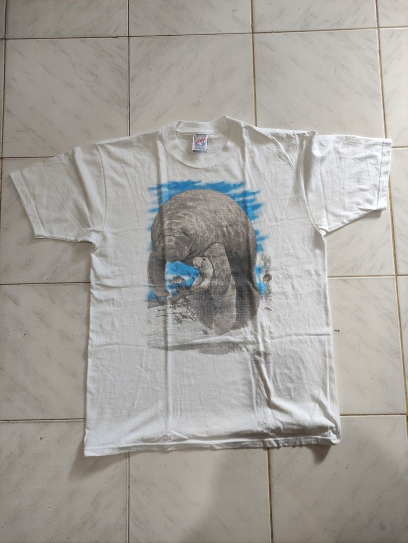 VINTAGE Manatee Shirt by Jerzees (Category: Tshirts & Polo Shirts ) located in Bacolod City. Submitted by lilhak (Listing ID 1362184127, Image 1). Description: - Size L - Issue big print kinda faded - DM to purchase - No cancellation, no bogus buyer.