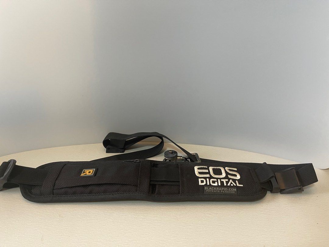 BlackRapid Classic Camera Sling Strap (Category: Camera Bags & Carriers) located in Quezon City. Submitted by iker3091 (Listing ID 1362394559, Image 1). Description: Original Blackrapid Camera Single Sling Strap can be comfortably worn on the left or right shoulder, with the camera securely located at the opposite hip when not shooting. It even includes a small zippered pocket for storing memory cards, ID or credit cards, and cash to keep your es