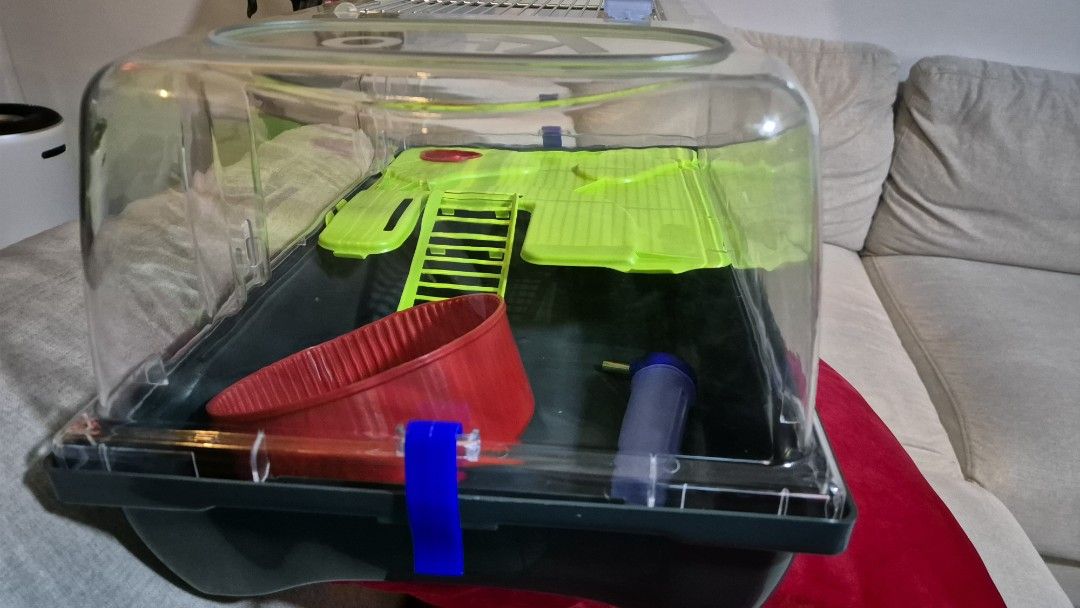 Hamster Cage (Category: Homes & Other Pet Accessories) located in Singapore. Submitted by aanya05 (Listing ID 1362308983, Image 2). Description: Hamster Cage. Lightly used. Only used the box, never used the accesories that came with it (bottle, spinning wheel, green platform, food bowl, ladder). Collection at Jurong West St 42. Dimension: 57×37x31h.