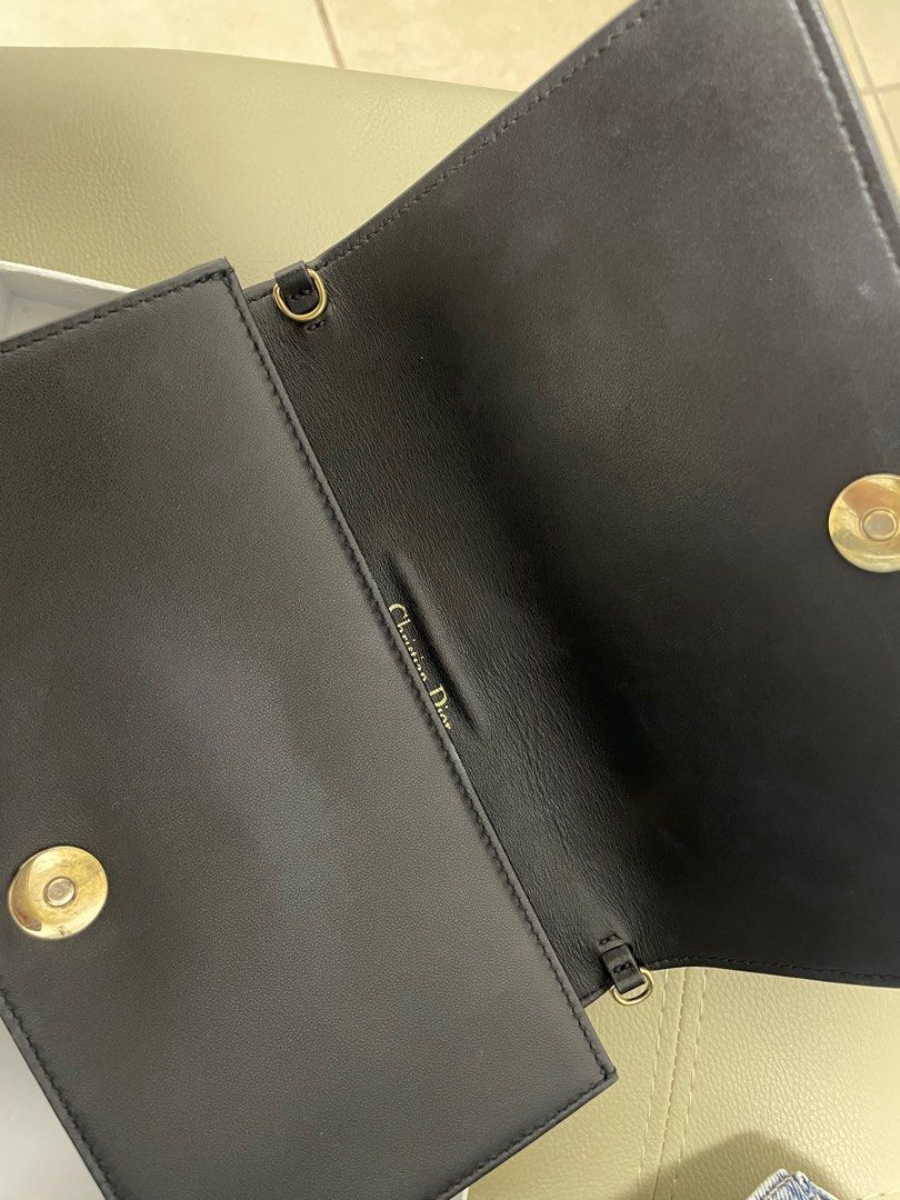 Lady Dior Pouch Black Cannage (Category: Luxury Bags & Wallets) located in Manila. Submitted by fashieclothing (Listing ID 1362431193, Image 2). Description: 💯 Authentic With card, box, dustbag • Main composition: lambskin • Lambskin and technical fabric lining • Detachable D.I.O.R. charms • One large interior compartment • One slip pocket • Two removable elements: one zipped pouch and one pouch with eight card slots and one slip pocket • Remova