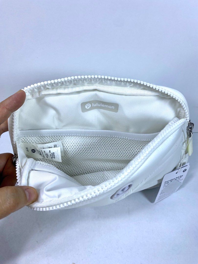 Lululemon Wunder Puff Belt Bag Large White (Category: Cross-body Bags) located in San Fernando. Submitted by trixietees (Listing ID 1362355251, Image 3). Description: Lululemon Wunder Puff Belt/ Crossbody Bag Large White Inspired by the look of our Wunder Puff outerwear collection, this Wunderfully puffy and quilted cross-body has two zippered compartments to keep essentials organized. water-repellent fabric features Adjustable strap Back drop-in