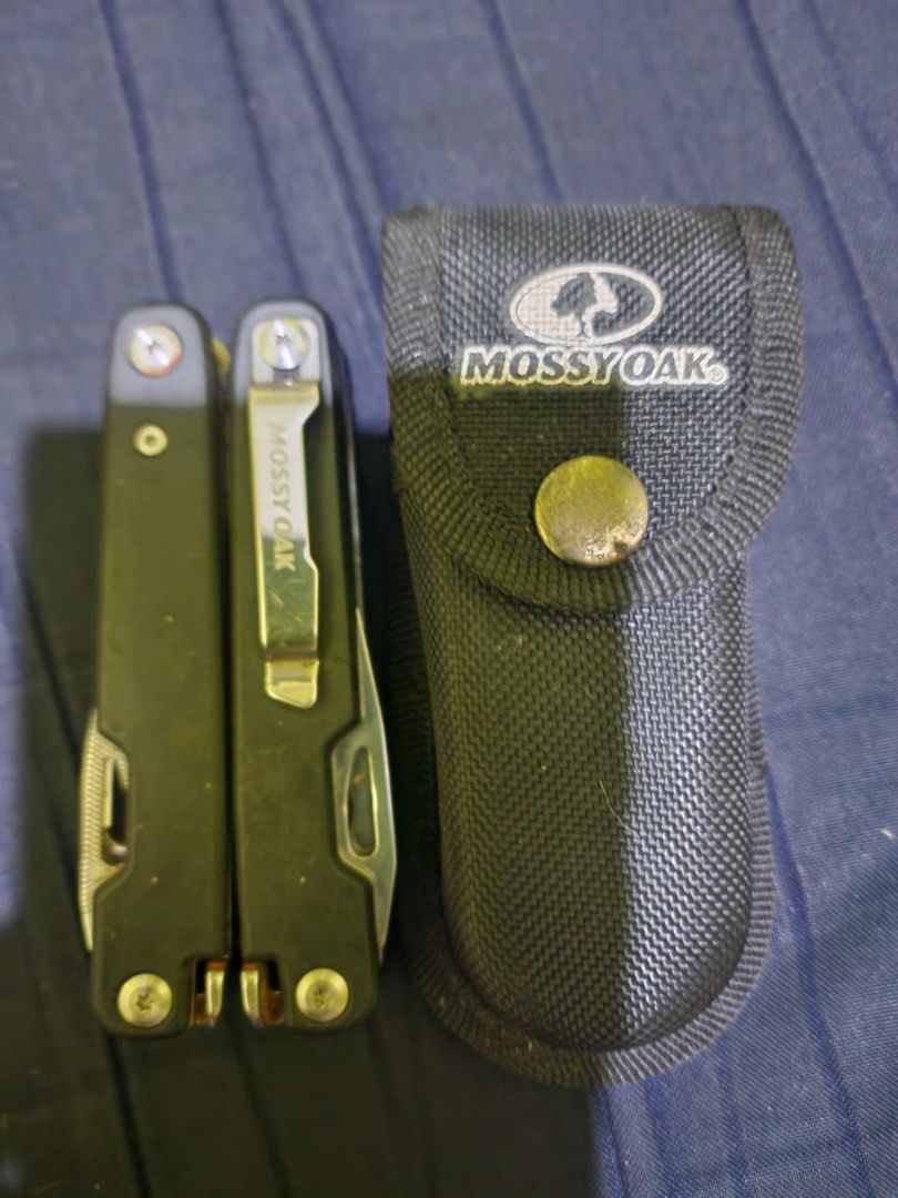 Mossy Oak Multi-tool (Category: Home Improvement Tools & Accessories) located in Manila. Submitted by savilaaa (Listing ID 1362440631, Image 1). Description: MOSSY OAK 21 in 1 Multi Function Pliers Stainless Steel Portable Pocket Knife with Sheath for Outdoors Survival Camping.