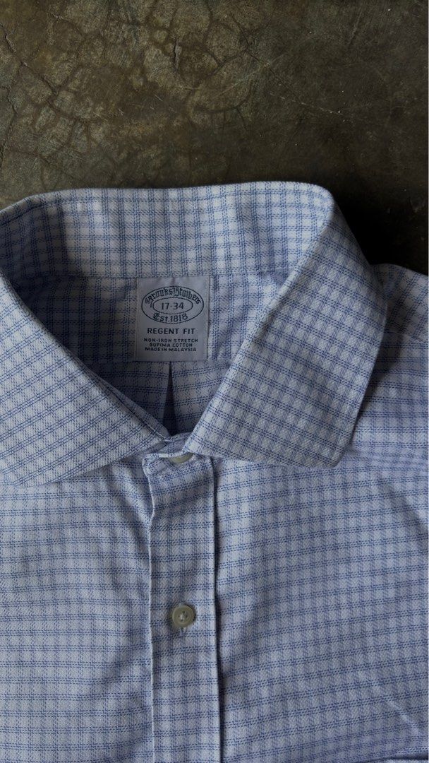 Brooks Brothers Regent long sleeves (Category: Tshirts & Polo Shirts ) located in Manila. Submitted by teept00p (Listing ID 1362560352, Image 2). Description: Brooks Brothers Regent long sleeves Regent fit shirts, designed to offer a modern silhouette that strikes the perfect balance between comfort and style. Crafted from high-quality fabrics, these shirts feature a tailored fit that accentuates your physique without feeling restrictive. Whether