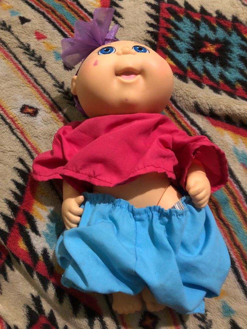 Cabbage Patch kids doll (Category: Babies & Kids Fashion) located in Quezon City. Submitted by markgolveo (Listing ID 1362599688, Image 3). Description: Cabbage Patch kids doll Signs of wears Loose dress garters Slight pen mark on cheek.
