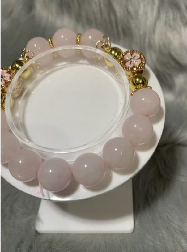 DIY Rose Quartz with Charm Bracelet (Category: Bracelets) located in Quezon City. Submitted by FashionSense4Less (Listing ID 1362553621, Image 3). Description: DIY Rose Quartz with Flower Charm Bracelet Rose Quartz -12mm Flower Charm - 11.8 16cm Standard Wrist Size Rose Quartz are said to enhance love and compassion. It promotes strong relations, encourages positive thoughts, helps regulate blood pressure, makes the person optimistic and strong. 