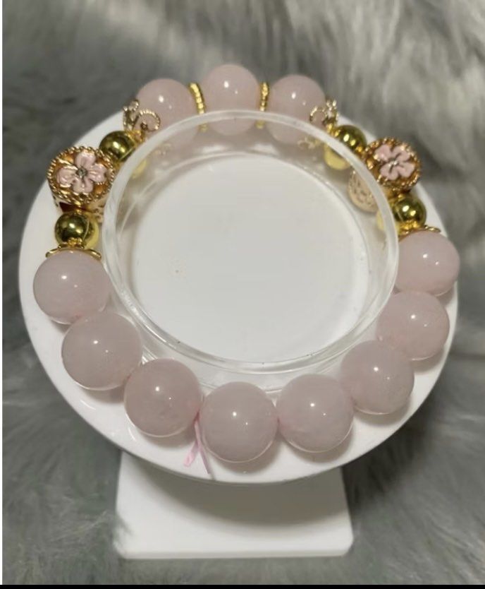DIY Rose Quartz with Charm Bracelet (Category: Bracelets) located in Quezon City. Submitted by FashionSense4Less (Listing ID 1362553621, Image 1). Description: DIY Rose Quartz with Flower Charm Bracelet Rose Quartz -12mm Flower Charm - 11.8 16cm Standard Wrist Size Rose Quartz are said to enhance love and compassion. It promotes strong relations, encourages positive thoughts, helps regulate blood pressure, makes the person optimistic and strong. 