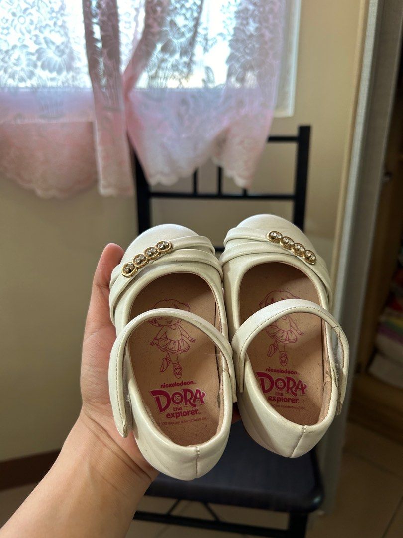 Dora shoes brand new (Category: Babies & Kids Fashion) located in Mandaluyong City. Submitted by decluterwithmae (Listing ID 1362518845, Image 3). Description: bn bought for christening but too small work almost 2k selling for a lower price kesa nakatabi size 21.
