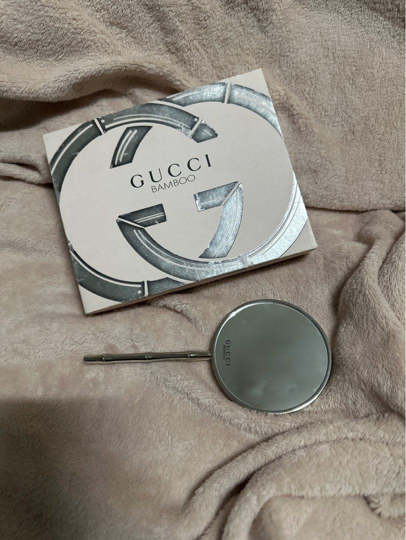Gucci Bamboo Hand Mirror (RARE) (Category: Mirrors) located in Marikina City. Submitted by dearly__ (Listing ID 1362634384, Image 1). Description: Gucci bamboo VIP new in box rare iconic mirror Double Mirror: one is Normal the other one Magnifying Box a little bit worn down, mirror unsed, zero scratches, still with film (one side). .