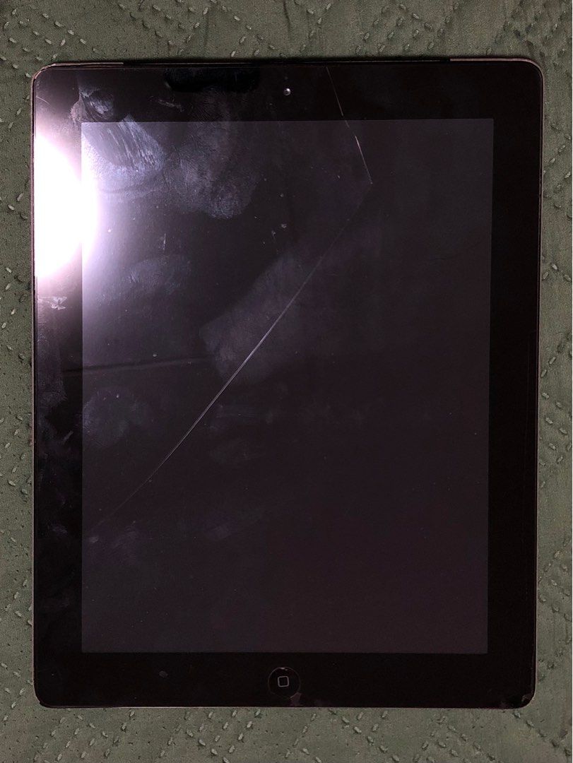 iPad 4th Gen second hand (Category: iPad) located in San Juan City. Submitted by zaenligane (Listing ID 1362556651, Image 2). Description: iPad 4th Gen 64GB issue: home button, scratches on tempered glass, sometimes glitches when overheat.