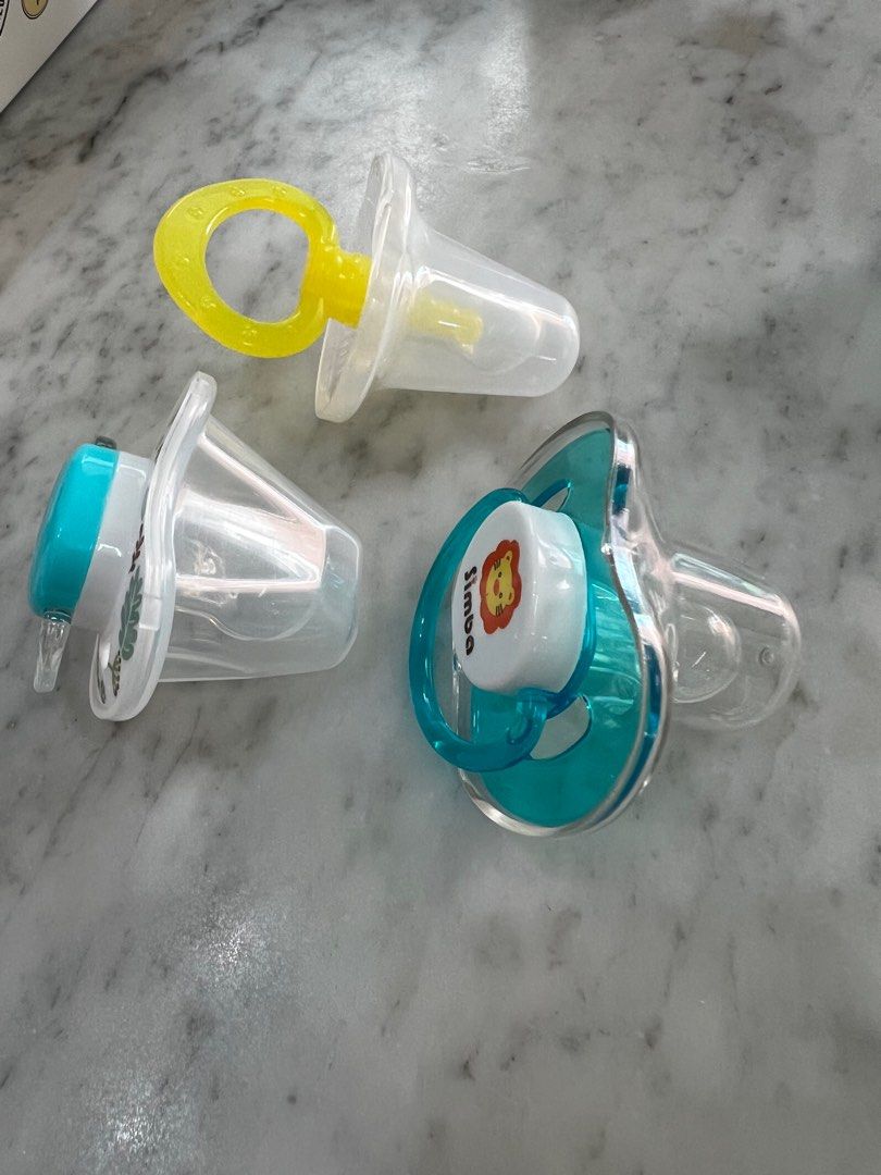 Simba pacifier (Category: Soothers & Pacifiers) located in Kuala Lumpur. Submitted by yrl14 (Listing ID 1362503319, Image 2). Description: Brand new pacifier , not even tried or washed before as my son refused all thumb shape pacifier 😣 the yellow one is massage pacifier for baby to bite to soothe their gum. Selling rm15 each or rm 35 for all .