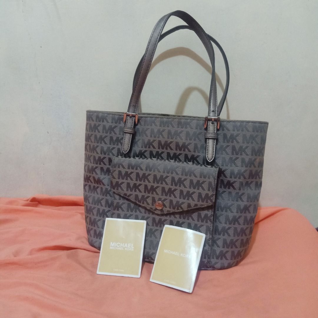 Authentic MK Gray Tote Bag (w/ care cards & QR code)) (Category: Luxury Bags & Wallets) located in Quezon City. Submitted by mari_x (Listing ID 1362753611, Image 2). Description: Legit MK Tote Bag with Care Cards & QR code From US Personal Bag Good as new Clean inside & out No flaws.