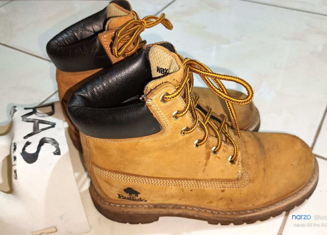 BUFFALO 6 holes leather boots (Category: Boots) located in Santo Tomas. Submitted by pickers_corner (Listing ID 1362686927, Image 1). Description: BUFFALO 6 holes leather boots size 230 or 6.5US very good condition issue minor heel drag and scratches .