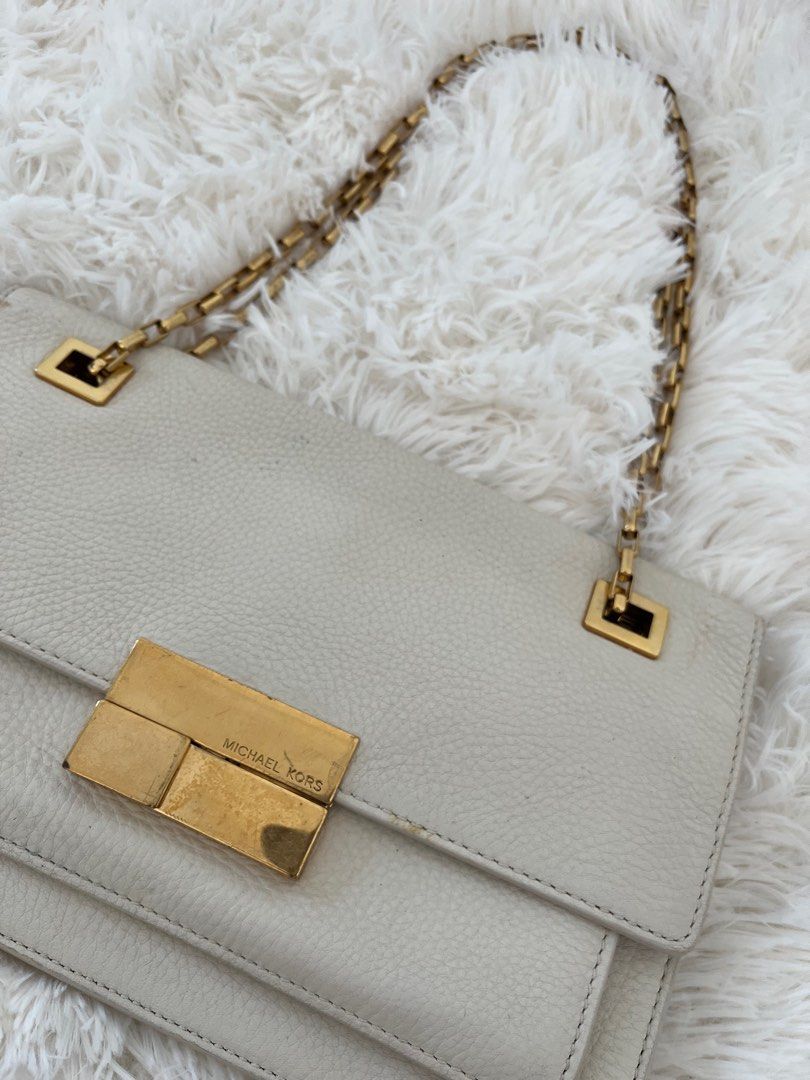 Michael Kors gold sling bag (Category: Luxury Bags & Wallets) located in San Jose. Submitted by mlvd31 (Listing ID 1362672614, Image 3). Description: Michael Kors gold sling bag Good condition but no damage Needs recoloring Negotiable .