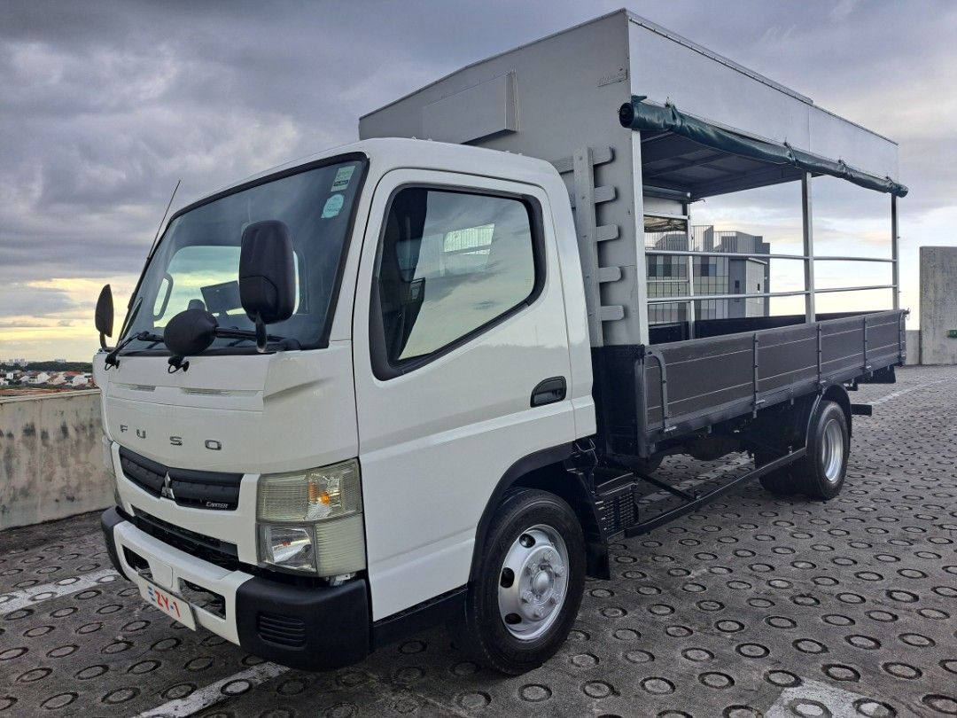 Mitsubishi Fuso Canter FEB71 (Category: Used Commercial Vehicles for Sale) located in Singapore. Submitted by ezy-1 (Listing ID 1362710505, Image 1). Description: 🔥Mitsubishi FEB71 14FT 🔥 ✅️ONE OWNER ✅️GOOD CONDITION ✅️CLASS 3 LICENSE ✅️NEW PAINTWORK ✅️100% LOAN ✅️SLIDING CANOPY ✅️CARRY UP TO 4.2 TON ✅️HIGH TRADE IN 🍍🍍🍍🍍🍍🍍🍍🍍🍍🍍🍍🍍 ☎️CALL ME CY NOW COME VIEWING AND TEST DRIVE. 🎊🎊🎊🎊 ☎️85568225 Cykho ☎️85568225 Cykho ☎️85568225 Cykho