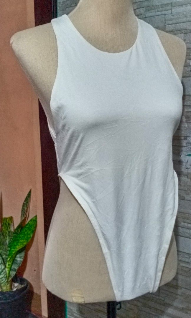 Shein White Sexy Bodysuit Large (Category: Sleeveless) located in Makati City. Submitted by decluttering_stuff101 (Listing ID 1362754209, Image 1). Description: excellent condition.
