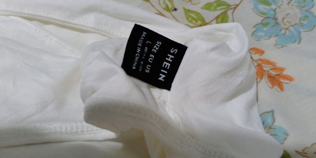 Shein White Sexy Bodysuit Large (Category: Sleeveless) located in Makati City. Submitted by decluttering_stuff101 (Listing ID 1362754209, Image 3). Description: excellent condition.