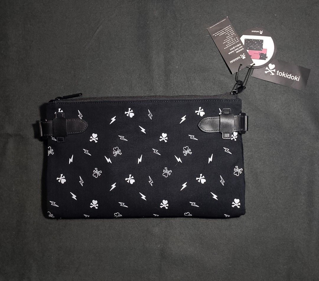 Tokidoki 2 face clutch bag (Category: Luxury Bags & Wallets) located in Cadiz. Submitted by comradstuff (Listing ID 1362715036, Image 1). Description: Tokidoki 2 face clutch bag brand new.