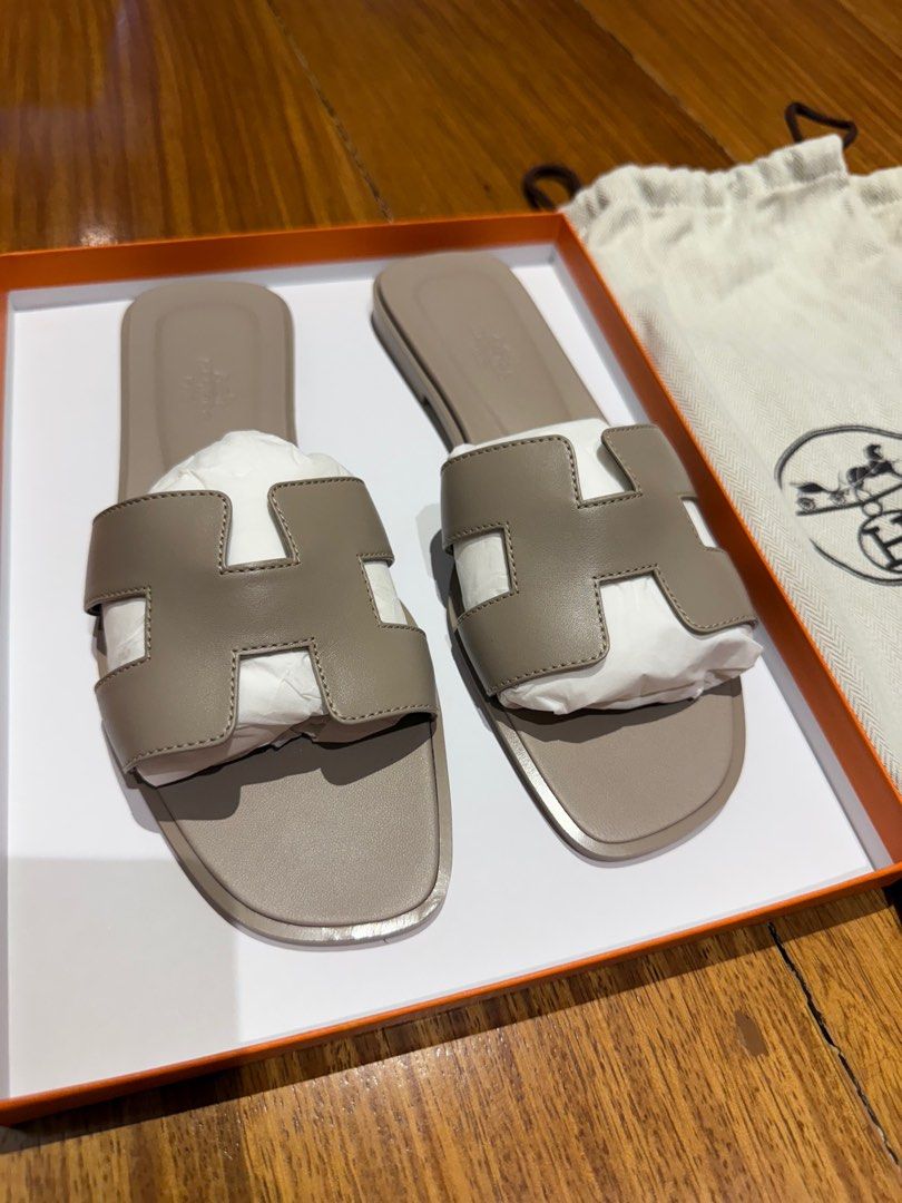 AUTHENTIC (with store receipt) Hermes Oran 38.5 Beige Mastic (Category: Sneakers & Footwear) located in Quezon City. Submitted by dianeellice (Listing ID 1366604472, Image 1). Description: Purchased in Paris last June 2023 Brand New Kept Unused Includes Box, dust bag and receipt (photocopy only) .