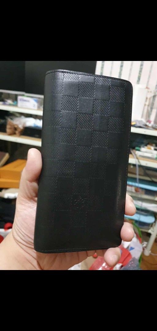 Authentic LV Damier Infini Brazza. (Category: Luxury Bags & Wallets) located in Mandaluyong City. Submitted by thenobleguy5717 (Listing ID 1366549028, Image 1). Description: For sale only. Legit/Authentic. Coded. SP5125. Made in France. Damier infini Brazza 16 card slots. In good condition Pm or comment lng thanks. Thanks in advance admin. 15k only negotiable. RFS: Need cash.