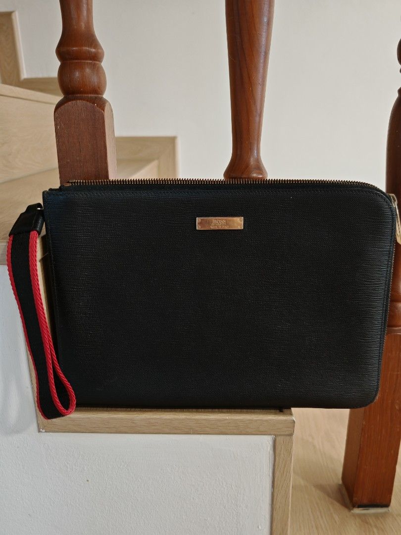 Boss clutch for Men (Category: Bags & Wallets) located in Singapore. Submitted by van_z_lim (Listing ID 1366731017, Image 1). Description: Self collection only Lightly use and still in good condition men clutch bag No dust bag no box 4 pocket and 1 slip pocket inside Estimate size: length 30cm height 22cm.