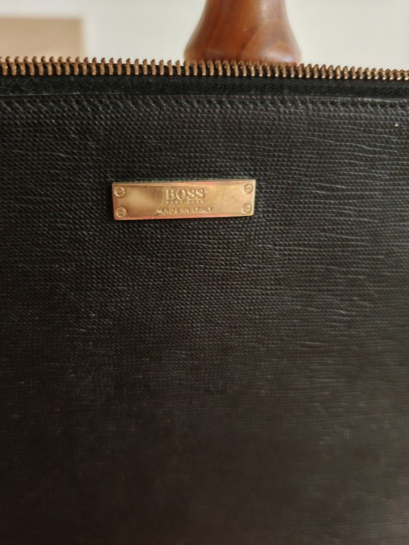 Boss clutch for Men (Category: Bags & Wallets) located in Singapore. Submitted by van_z_lim (Listing ID 1366731017, Image 2). Description: Self collection only Lightly use and still in good condition men clutch bag No dust bag no box 4 pocket and 1 slip pocket inside Estimate size: length 30cm height 22cm.
