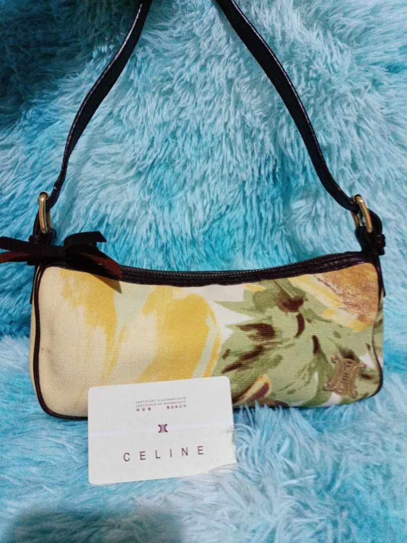 Celine Brown Printed Canvass Baguette Authentic (Category: Luxury Bags & Wallets) located in Santo Tomas. Submitted by mybellacloset158 (Listing ID 1366649695, Image 2). Description: Authentic Celine Baguette Canvass In Excellent Condition No Flaws, clean inside and out. Can Fit wallet and Iphone pro Good as Brand New 📌This baguette features a printed canvass body, a flat leather strap, a top zipper closure and an interior slip pocket. With code
