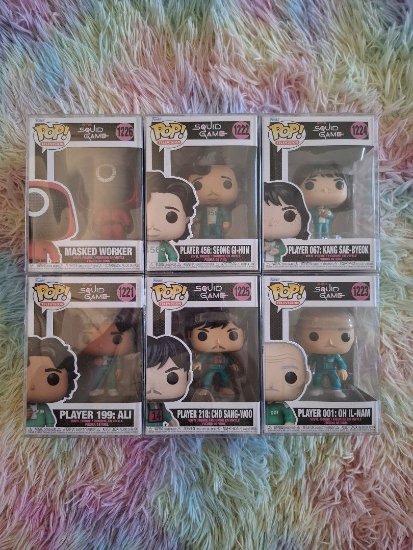Funko Pop Squid Game Edition ✨️ (Category: Designer & Blind Box Toys) located in Manila. Submitted by psstkhai (Listing ID 1366658686, Image 1). Description: Sold as set for 3k ✨️ Still negotiable, PM lang po. *Protectors are included. Can ship thru: Lalamove Grab RFS: upgrading to Skullpanda 🤫.