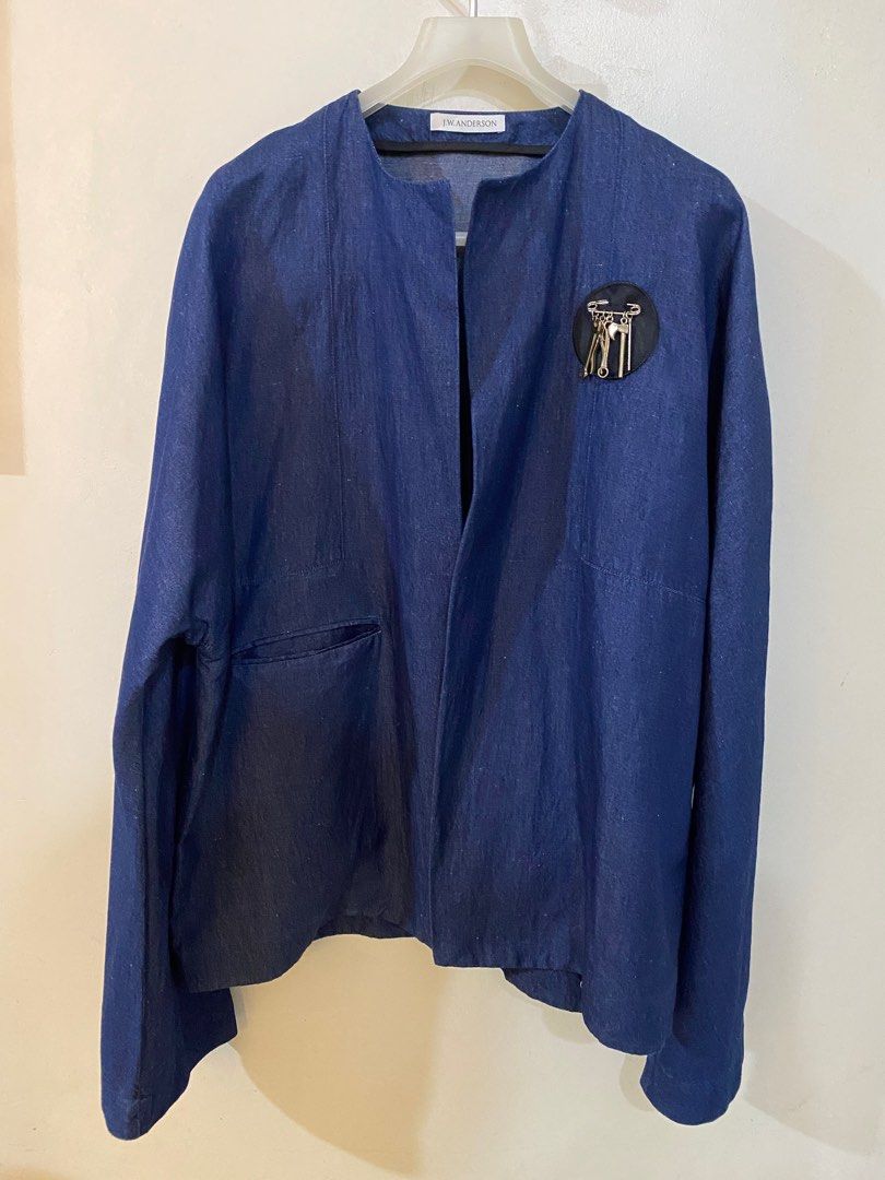 JW Anderson Jacket (Category: Luxury Apparel) located in Pasig City. Submitted by capsulecollection (Listing ID 1366711448, Image 1). Description: JW Anderson round neck jacket Indigo blue color Silver finish brooch accent Oversized fit Size US 36 Made in Poland.