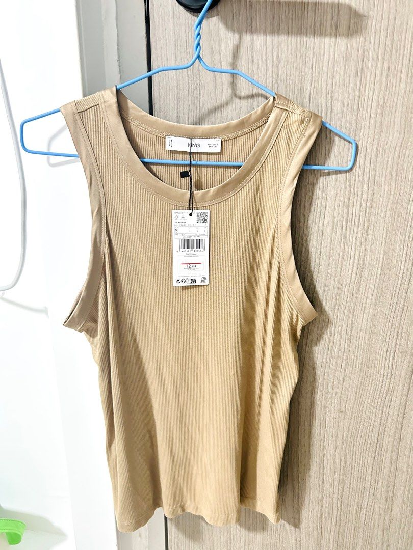 MANGO Tank Top (Category: Sleeveless) located in Singapore. Submitted by kkn297 (Listing ID 1366707708, Image 1). Description: New with tag as photos showed All time favourite basic tank top, especially for summer and beach time. Basic design with the silk lining. Size guide from Mango for chest 86-88cm #tanktop #MNG #Mango.
