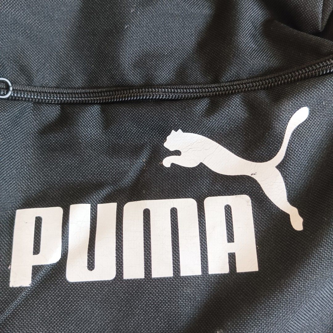 Orginal Puma Black Backpack (Category: Backpacks) located in Masantol. Submitted by chumfairy (Listing ID 1366569690, Image 2). Description: Honest flaw: cracks sa PUMA logo but overall like new Small Size Length: 15" Width: 11".