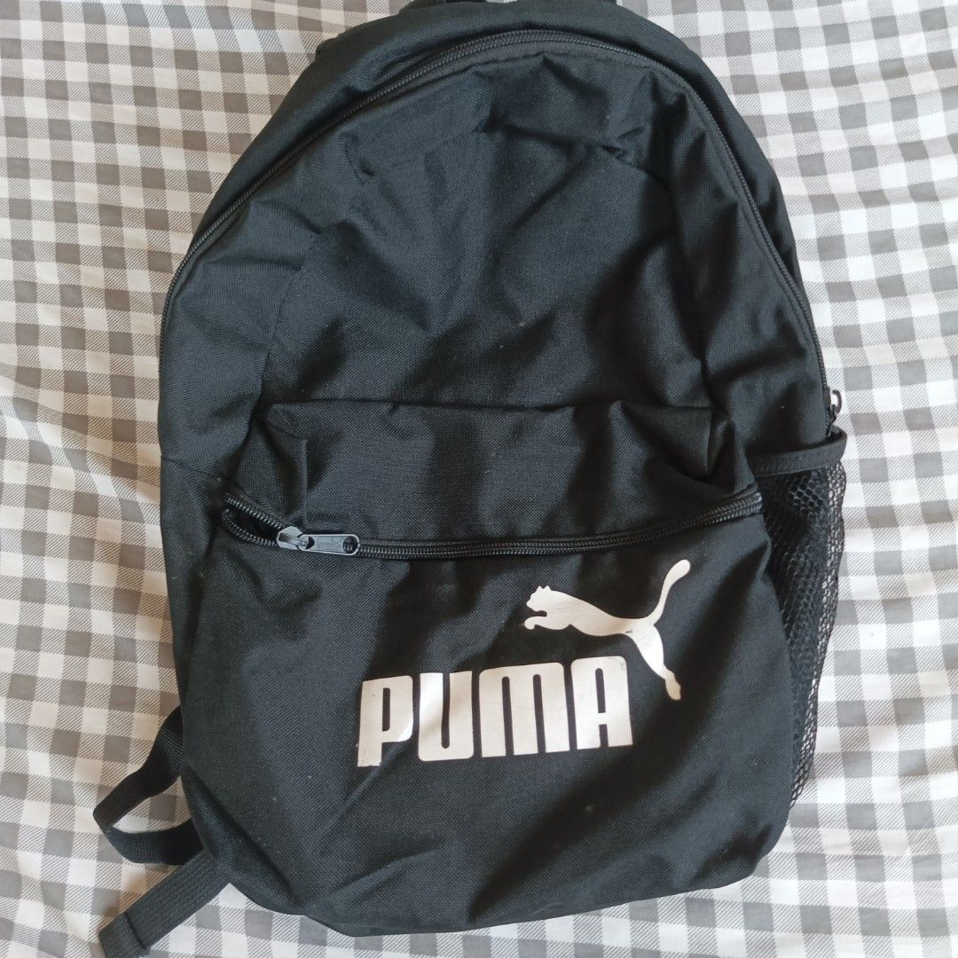 Orginal Puma Black Backpack (Category: Backpacks) located in Masantol. Submitted by chumfairy (Listing ID 1366569690, Image 1). Description: Honest flaw: cracks sa PUMA logo but overall like new Small Size Length: 15" Width: 11".