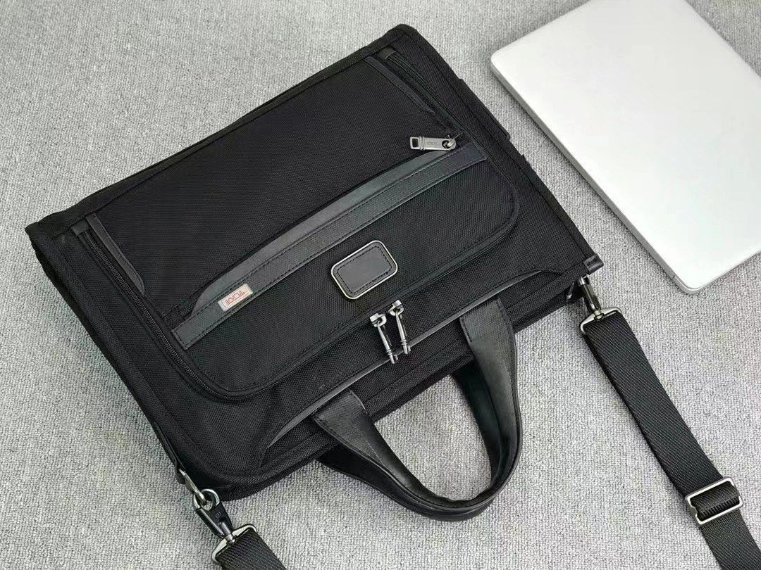 Tumi Slim Deluxe laptop briefcase (Category: Briefcases) located in Manila. Submitted by bagmaniaph (Listing ID 1366719168, Image 3). Description: This slim portfolio-style brief features a zip-around opening for easy access to the main compartment. The interior features a padded laptop pocket, and multiple pockets for tech and business accessories. A magnetic slip pocket on front lets you stash and retrieve your phone effortlessly..