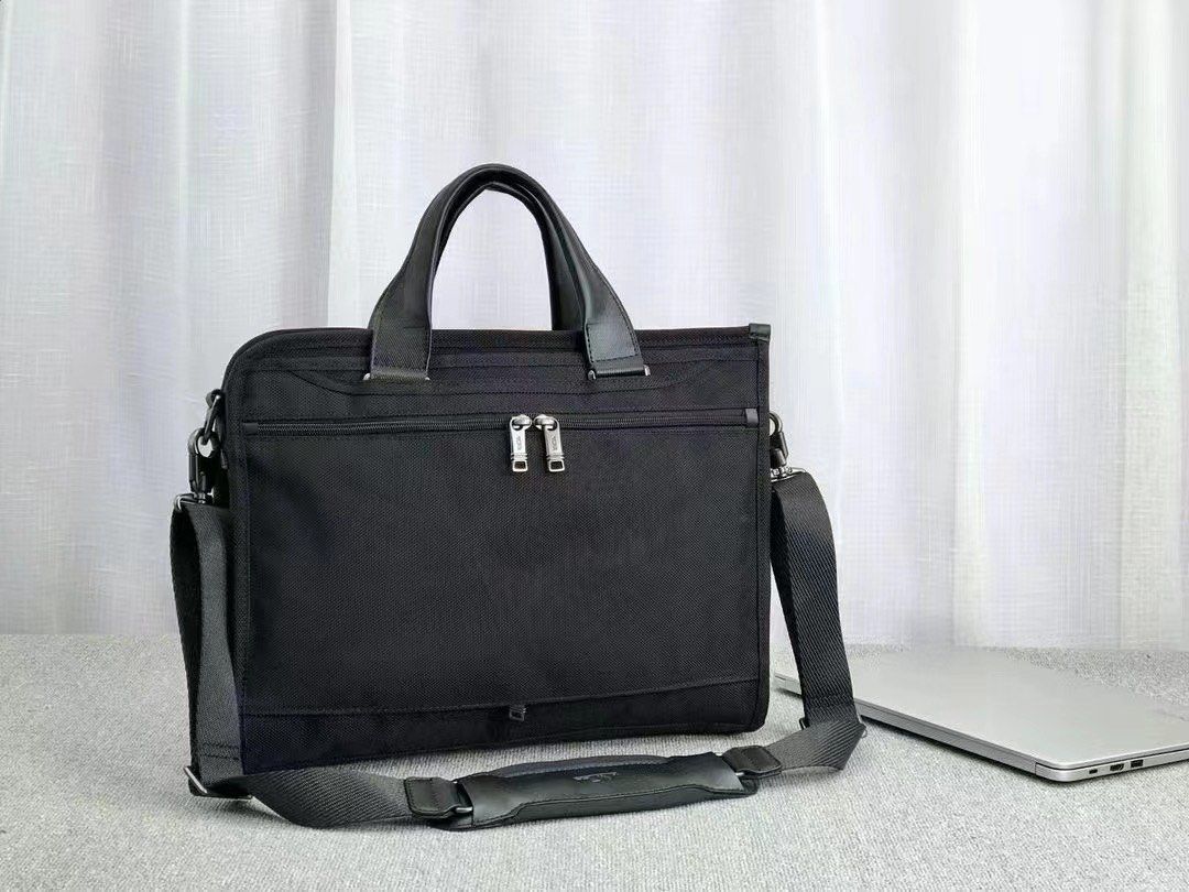 Tumi Slim Deluxe laptop briefcase (Category: Briefcases) located in Manila. Submitted by bagmaniaph (Listing ID 1366719168, Image 2). Description: This slim portfolio-style brief features a zip-around opening for easy access to the main compartment. The interior features a padded laptop pocket, and multiple pockets for tech and business accessories. A magnetic slip pocket on front lets you stash and retrieve your phone effortlessly..