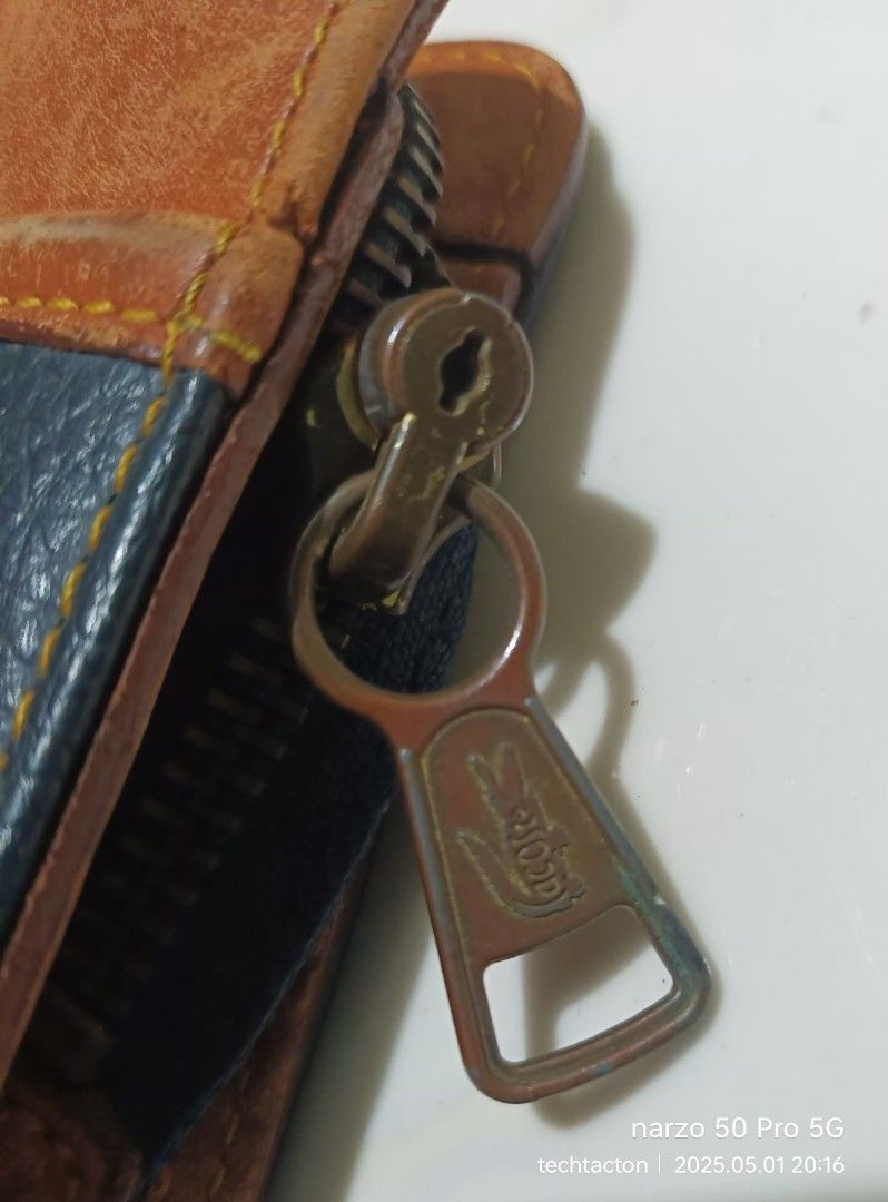 vintage LACOSTE clutch bag (Category: Luxury Bags & Wallets) located in Santo Tomas. Submitted by pickers_corner (Listing ID 1366677989, Image 2). Description: pristine condition no holes no stain.