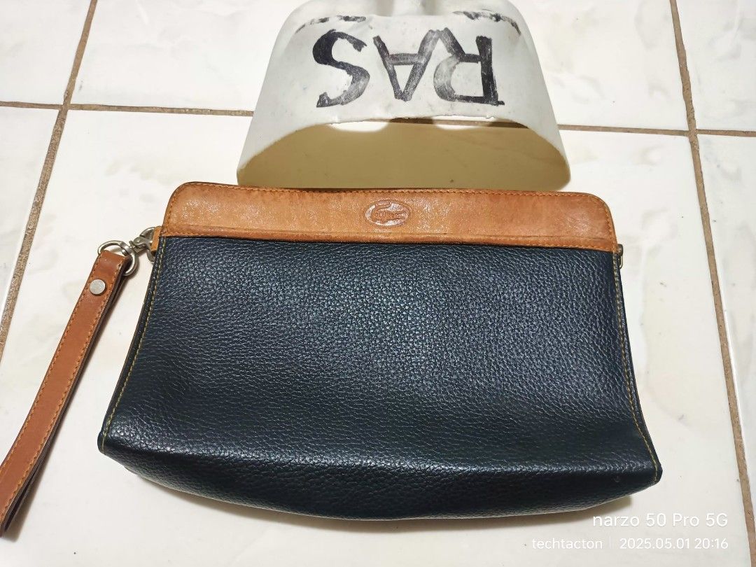 vintage LACOSTE clutch bag (Category: Luxury Bags & Wallets) located in Santo Tomas. Submitted by pickers_corner (Listing ID 1366677989, Image 1). Description: pristine condition no holes no stain.