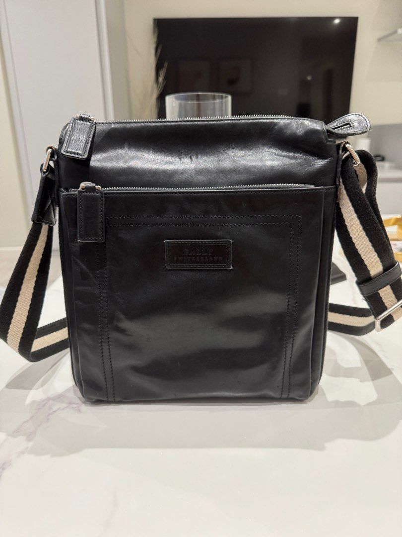 Bally Tuston Messenger Bag (Category: Luxury Bags & Wallets) located in Manila. Submitted by joanne727 (Listing ID 1368294128, Image 1). Description: Bally Messenger Bag Model: Tuston Color: black Inclusion: dust bag Condition: used just twice for a trip. Just kept. Minor flaw but barely noticeable as seen on last pick (trimming of the handles) other than that in very good condition. No damage else. Guaranteed authentic bought in Duty Free Philip