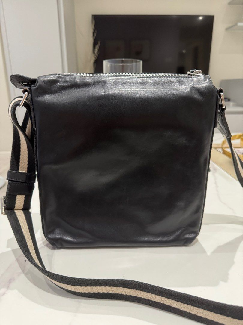 Bally Tuston Messenger Bag (Category: Luxury Bags & Wallets) located in Manila. Submitted by joanne727 (Listing ID 1368294128, Image 2). Description: Bally Messenger Bag Model: Tuston Color: black Inclusion: dust bag Condition: used just twice for a trip. Just kept. Minor flaw but barely noticeable as seen on last pick (trimming of the handles) other than that in very good condition. No damage else. Guaranteed authentic bought in Duty Free Philip