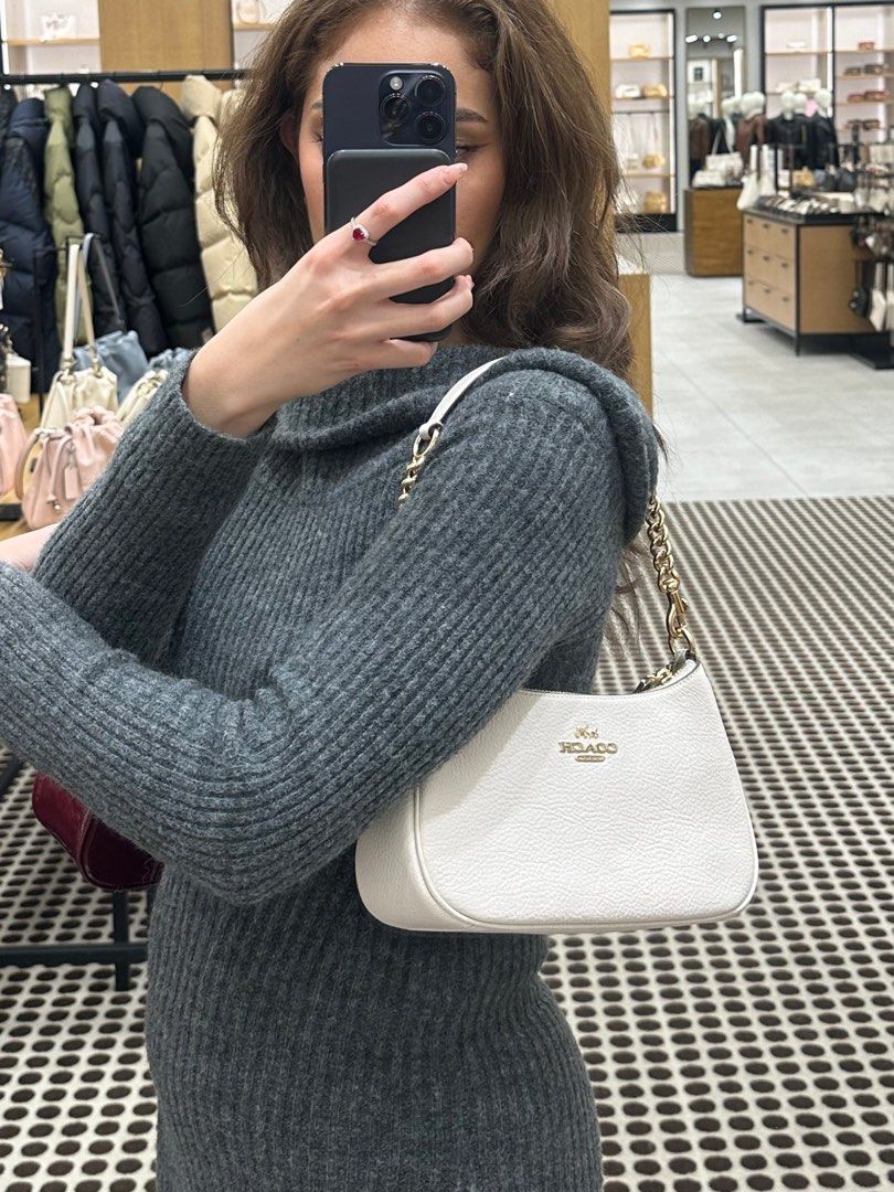 Coach Teri Shoulder Bag in White (Category: Luxury Bags & Wallets) located in Manila. Submitted by nicolebhans (Listing ID 1368310815, Image 3). Description: • Authentic with Tags and Dust Bag • Bought in Japan (with authentication card) • Brand New • Retails for Php 19k based from coach website (can send link) Php 15k (LAST PRICE) RFS: Too many white bags Can meet up or do deliver 👇🏻 Delivery: Grab, lalamove, j&t Meet up: Glorietta or Greenbel