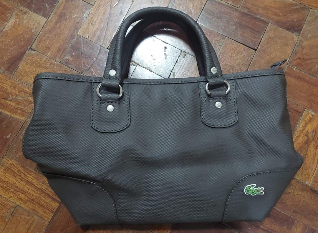 Leather Lacoste Original Hand bag handbag (Category: Luxury Bags & Wallets) located in Quezon City. Submitted by bennshopp (Listing ID 1368298417, Image 1). Description: RFS: too many bags, declutter delivery only.