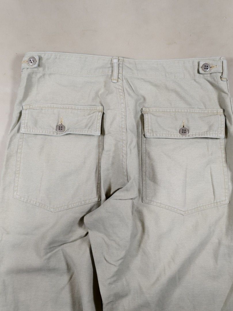 Nepenthes Hoggs Utility Baker Pants - Light Beige (Category: Trousers) located in Roxas City. Submitted by fadesandpatinas (Listing ID 1368366281, Image 3). Description: Nepenthes Hoggs Utility Baker Pants - Light Beige Tagged Large Fits 32-33" Measurements: Waist - 16.3" Rise - 12.5" Thighs - 12.5" Inseam - 28.7" Length - 39.5" Hem - 9.8" A unique twist on a military staple, the Hoggs Utility Baker Pants by Nepenthes reinterprets the classic OG-