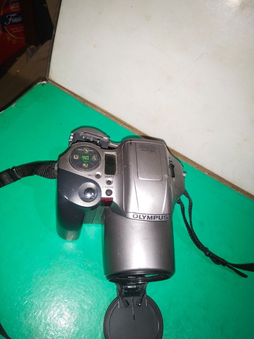 OLYMPUS 28-110 Camera/As Is/Not Working/UNTESTED (Category: Cameras) located in Del Monte. Submitted by zurckram777 (Listing ID 1368307330, Image 3). Description: Olympus 28-110. Digital camera that uses 35 mm film. Not working. AS IS. UNTESTED. JAPAN. Good as a restoration project. Lens cover is quite unique because it swivels down or up. Original 35 mm film is still inside. Nice display,too. Bahala na po kayo mag restore or get parts. In POOR c