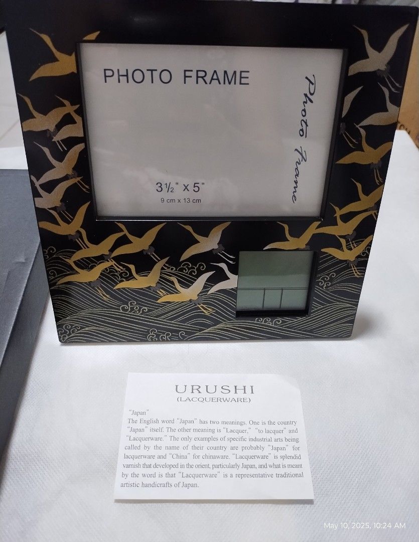 JAPAN PHOTO FRAME CLOCK (Category: Frames & Pictures) located in Paranaque City. Submitted by maapolonio (Listing ID 1368238175, Image 1). Description: made and bought in Japan authentic URUSHI LACQUERWARE product batteries included body frame is 18.5cm x 18.5cm photo frame is 9cm x 13c perfect as a gift.