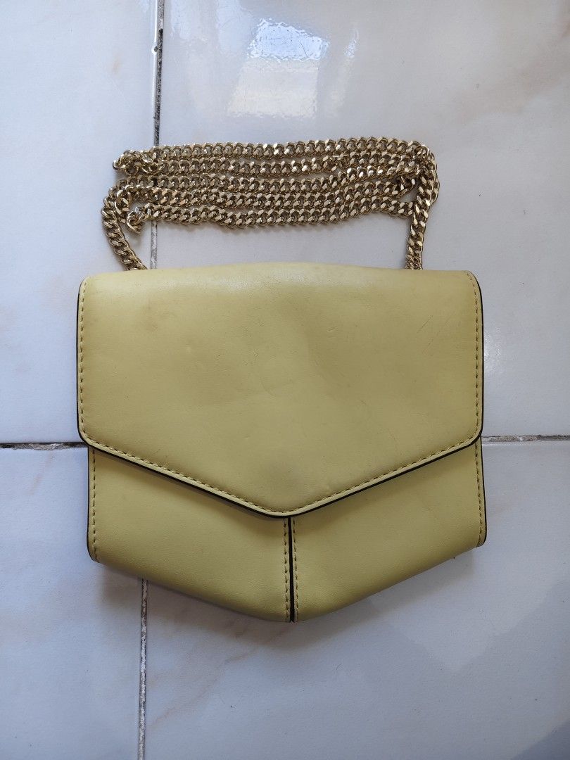Sandro Paris Bag (Category: Luxury Bags & Wallets) located in Baguio. Submitted by gandita.28 (Listing ID 1368243446, Image 1). Description: Sandro mini Lou cross body bag in yellow Needs Cleaning No issues Browse photos for length and width 2499 free Ship.