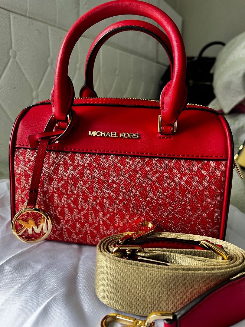 Authentic Michael Kors Jet Set XS Duffel (Category: Luxury Bags & Wallets) located in Paranaque City. Submitted by chayfigz (Listing ID 1368565566, Image 1). Description: REPRICED. Di halos nagamit to. Can pass as brand new. Bought in Canada. Not easily found here sa Pinas. Very clean, smooth and no issues at all. Michael Kors Travel Mini Duffle 2 way Satchel, also known as a crossbody bag. It features the brand's signature logo print and is desi