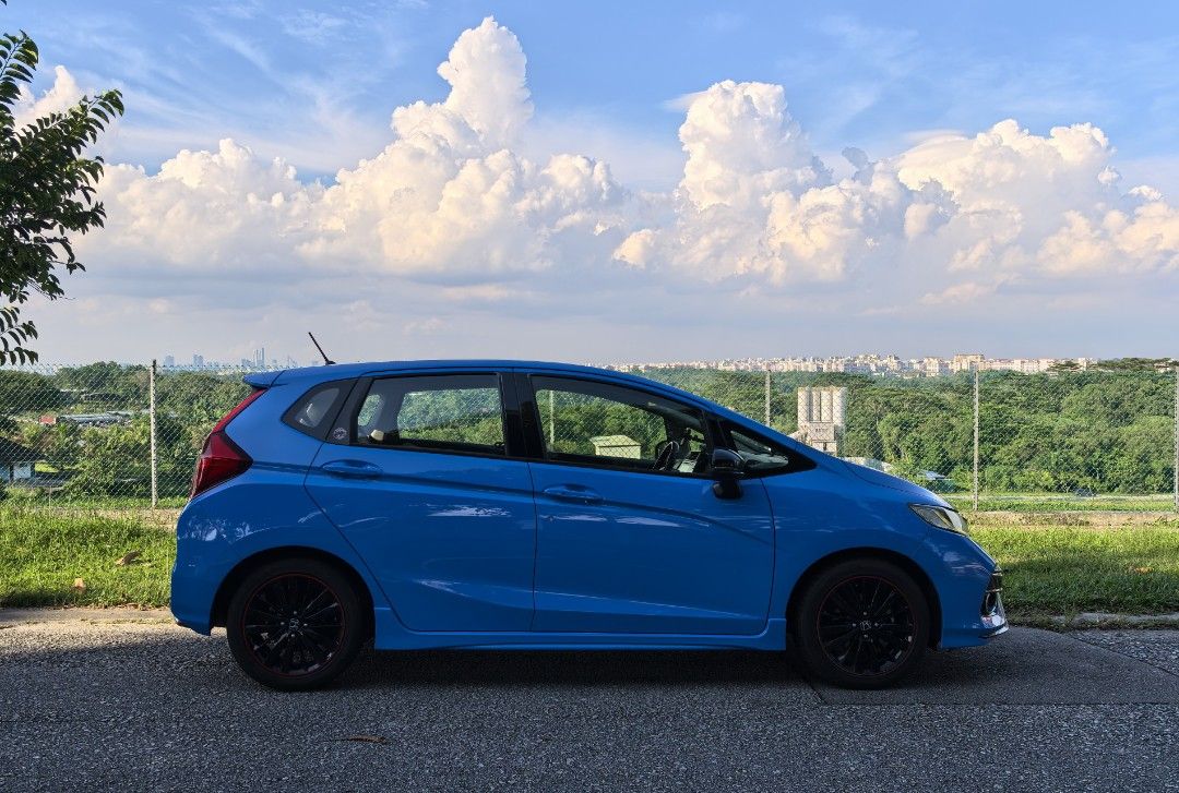 Honda Jazz 1.5 RS (M) (Category: Used Cars) located in Singapore. Submitted by bobthe11th (Listing ID 1368429899, Image 3). Description: rare manual gk5. even rarer Boost Blue FL5 paintwork! 6 speed gearbox. road tax paid till Aug 2026. good fuel consumption, easy to drive, 3/4 tank 500km. Cruise control, keyless entry, push start button. service every 10k with Motul engine oil. wear and tear done: shock absorber, steering rack, clutch, front con
