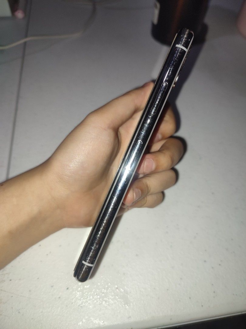 Iphone X 256gb (Category: iPhone X Series) located in Quezon City. Submitted by yumiyummy1215 (Listing ID 1368544655, Image 2). Description: Iphone X 256 gb Storage 100% Batt Health 98% smooth Face Id working No box Freebie: Phone Case (some are bnew), Tempered Glass from Power Mac, Charger. Issue: Parang may white sa screen but not an issue sa performance. Can do meet up (Timog QC) If Delivery: Payment First Slightly Negotiable Rfs: Upgrade.