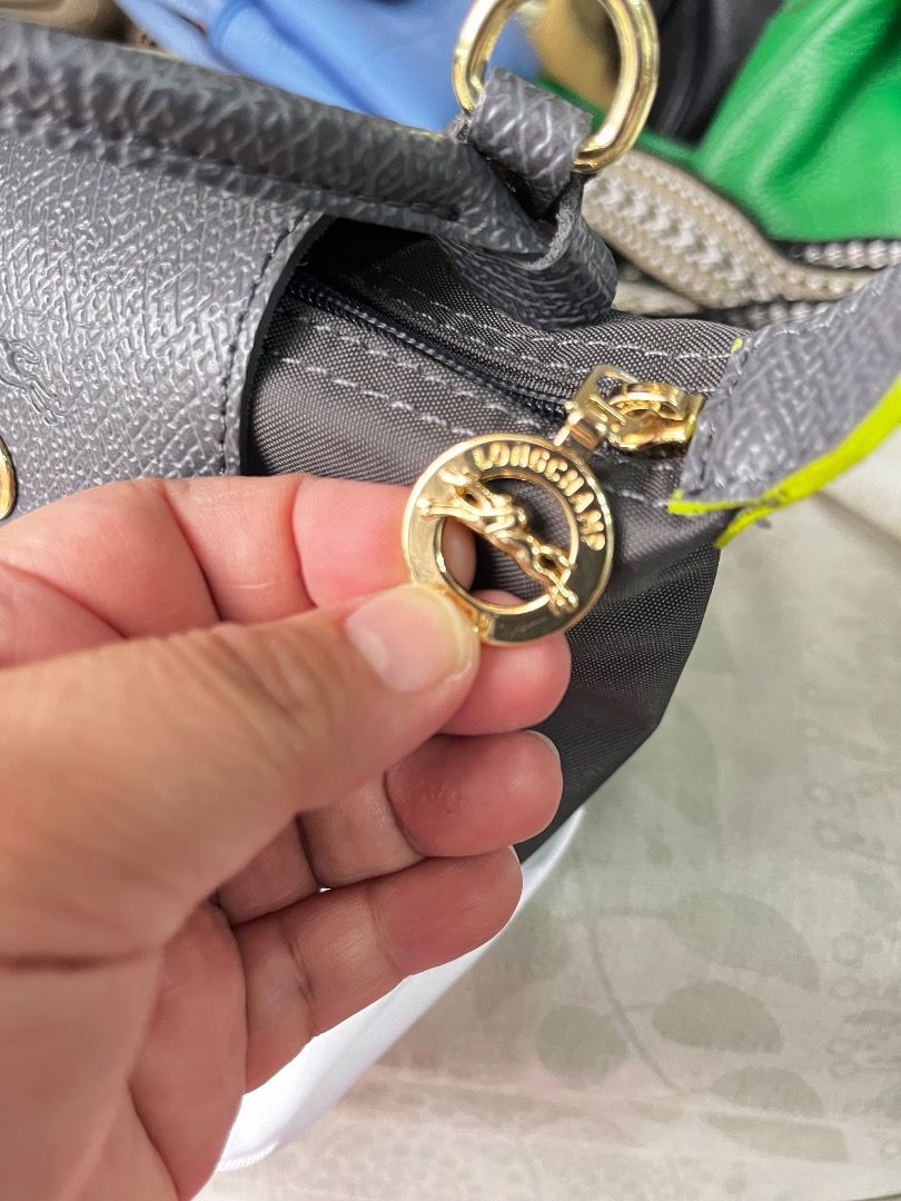 Longchamp Mini 2way sling bag (Category: Luxury Bags & Wallets) located in Paranaque City. Submitted by chayfigz (Listing ID 1368568197, Image 3). Description: Super cute nito. Mini size but can fit 2 iphones. No issues at all. Leather is in tact. No scratches. Di halos nagamit..